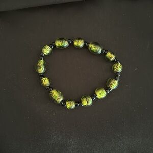 Murano Glass green bead bracelet gold spun with black beads